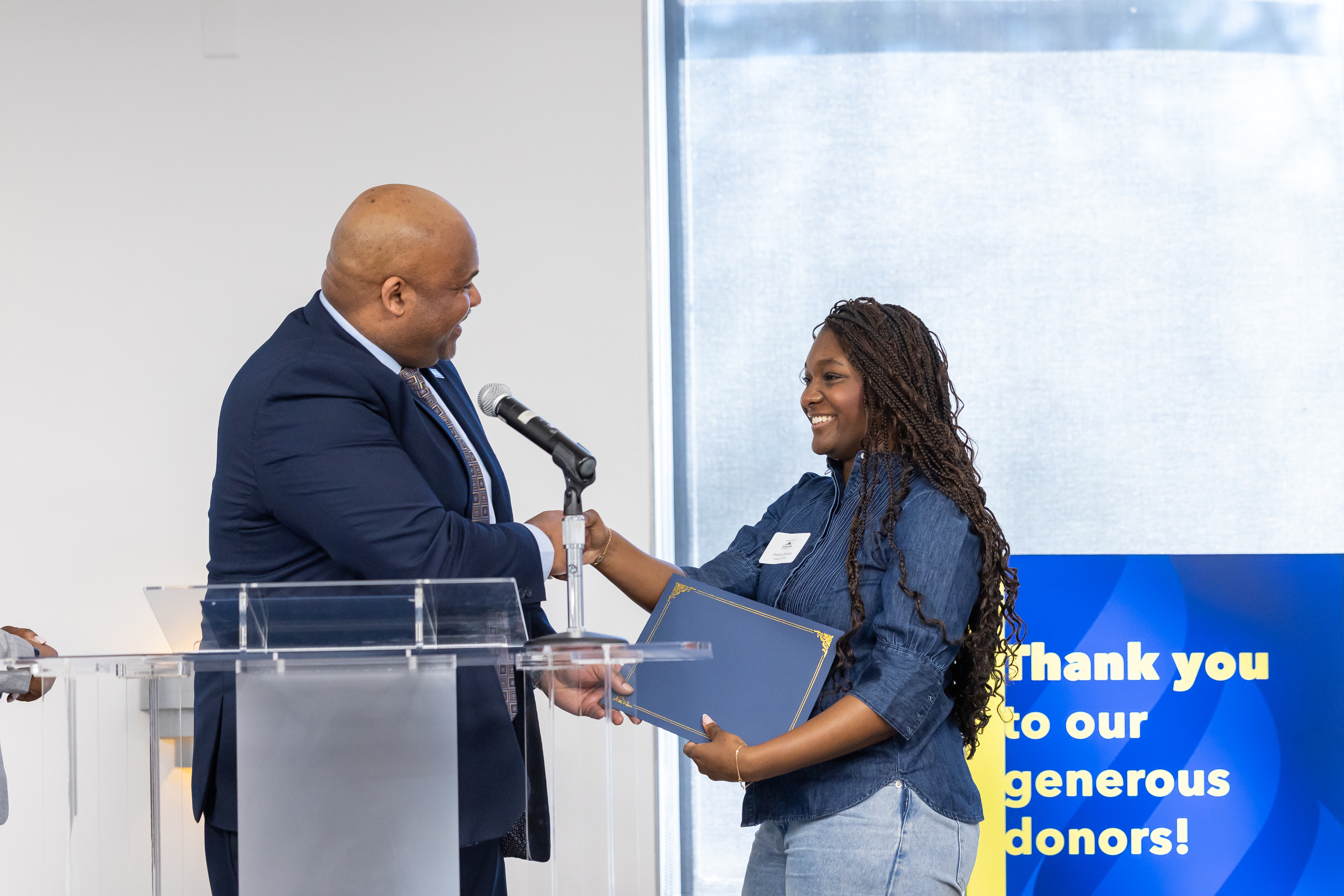 Associate Vice President David Hill presents incoming student scholarships