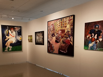 paintings in the Therese A. Maloney Art Gallery celebrating sports in art