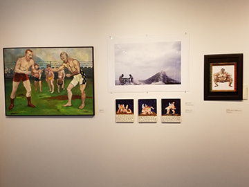 wrestler paintings in the Therese A. Maloney Art Gallery celebrating sports in art