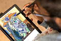 SEU art student drawing on tablet