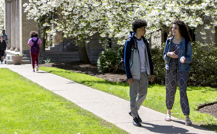 Two students walking through SEU's campus