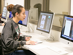 graphic design student in SEU computer lab