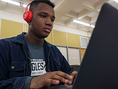 SEU cybersecurity student using computer