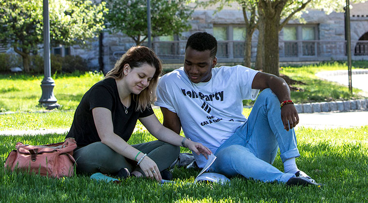 SEU students studying on campus lawn