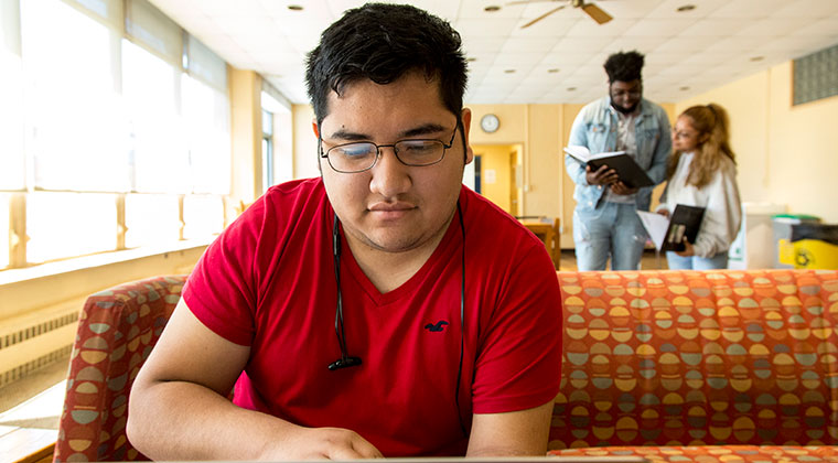SEU student reading in residence hall