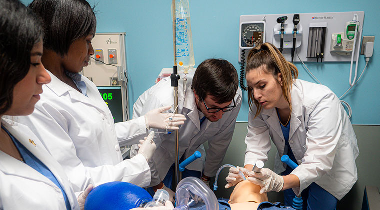group of clinical students learning at the SEU simulation center