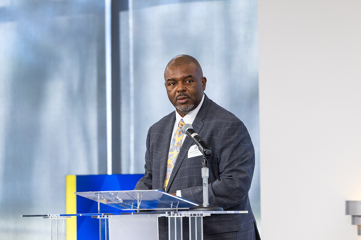 President Crosby speaks to a room of student scholars, prospective students, and their parents